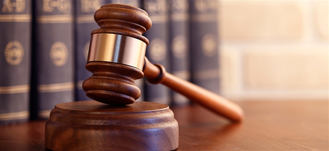 gavel with law books in background