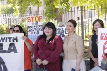 Photo of Karla TOledo Standing next to Mayor Regina Romero and Council Member Schubert at her press conference.