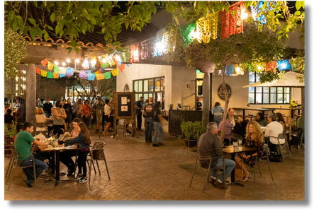 Mercado patio with lights and outdoor tables and patrons