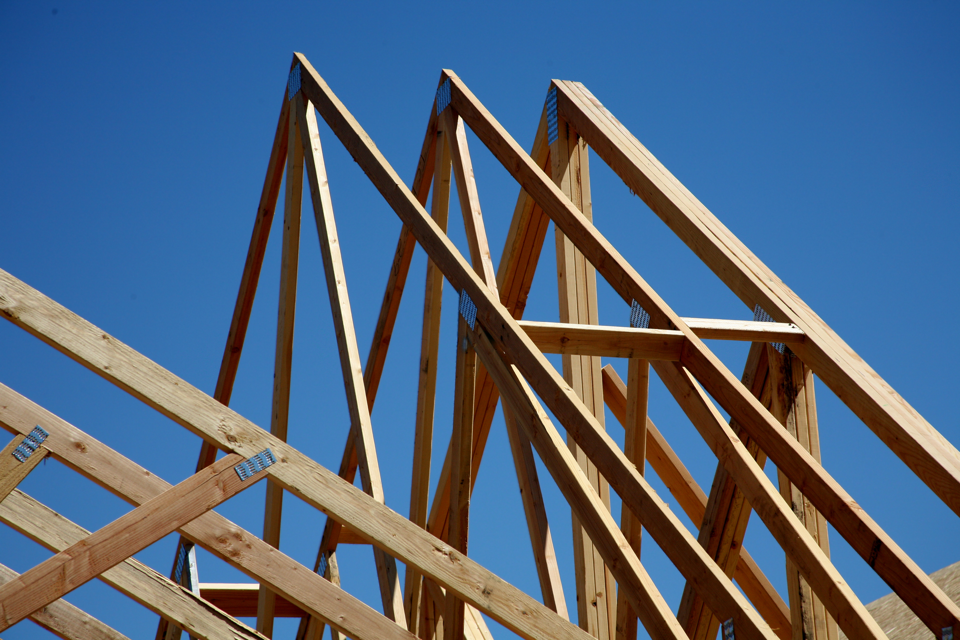The wood frame structure of a building under construction.